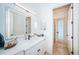 Bright bathroom with white vanity, quartz countertop, and a separate shower at 4419 Bayshore Ne Blvd, St Petersburg, FL 33703