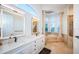 Luxurious bathroom with soaking tub, double vanity, and separate shower at 4419 Bayshore Ne Blvd, St Petersburg, FL 33703