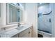 Modern bathroom with white cabinets, quartz countertops, and a large mirror at 4419 Bayshore Ne Blvd, St Petersburg, FL 33703