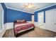 Bright bedroom with blue walls, a comfortable bed, and plenty of natural light at 4419 Bayshore Ne Blvd, St Petersburg, FL 33703