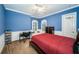 Blue bedroom with a comfortable bed and built-in workspace at 4419 Bayshore Ne Blvd, St Petersburg, FL 33703