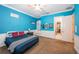 Bright bedroom with blue walls and a comfortable bed at 4419 Bayshore Ne Blvd, St Petersburg, FL 33703