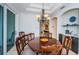 Elegant dining room with a round wooden table and six chairs at 4419 Bayshore Ne Blvd, St Petersburg, FL 33703
