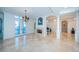 Bright dining room with hardwood floors, fireplace, and water views at 4419 Bayshore Ne Blvd, St Petersburg, FL 33703