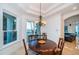 Bright dining room with water views and a round wooden table at 4419 Bayshore Ne Blvd, St Petersburg, FL 33703