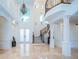 Two-story foyer with elegant staircase and chandelier at 4419 Bayshore Ne Blvd, St Petersburg, FL 33703