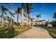 Beautiful two-story home with palm trees and a long driveway at 4419 Bayshore Ne Blvd, St Petersburg, FL 33703