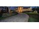 Elegant home with a curved driveway and landscape lighting at 4419 Bayshore Ne Blvd, St Petersburg, FL 33703