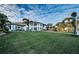 Luxury waterfront home with a large backyard and palm trees at 4419 Bayshore Ne Blvd, St Petersburg, FL 33703