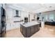 Spacious kitchen with island, stainless steel appliances, and white cabinetry at 4419 Bayshore Ne Blvd, St Petersburg, FL 33703