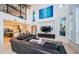 Living room features a sectional sofa and high ceilings at 4419 Bayshore Ne Blvd, St Petersburg, FL 33703