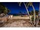 Outdoor kitchen and patio area at night at 4419 Bayshore Ne Blvd, St Petersburg, FL 33703