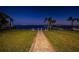 Brick pathway leading to a waterfront home at night at 4419 Bayshore Ne Blvd, St Petersburg, FL 33703