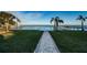 Stone pathway leading to the waterfront with boat docks at 4419 Bayshore Ne Blvd, St Petersburg, FL 33703