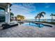 Spacious pool and patio area with lounge chairs and waterfront views at 4419 Bayshore Ne Blvd, St Petersburg, FL 33703