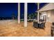 Night view of patio, pool, and waterfront at 4419 Bayshore Ne Blvd, St Petersburg, FL 33703