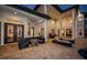 Backyard patio with fire pit and seating area at night at 4419 Bayshore Ne Blvd, St Petersburg, FL 33703
