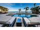 Stunning waterfront pool view with lounge chairs at 4419 Bayshore Ne Blvd, St Petersburg, FL 33703