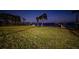 Night view of waterfront property with lush lawn at 4419 Bayshore Ne Blvd, St Petersburg, FL 33703