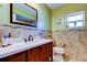 Clean bathroom with a modern vanity and tiled floors at 4728 Swallowtail Dr, New Port Richey, FL 34653