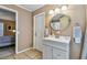 Bathroom with vanity, mirror, and shower at 5885 110Th N Ave, Pinellas Park, FL 33782