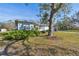 Side view of light blue house, large tree at 5885 110Th N Ave, Pinellas Park, FL 33782