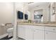 Clean bathroom with granite countertop, walk-in shower, and grab bar at 5909 Yorkshire Dr, Zephyrhills, FL 33542