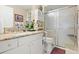 Well-appointed bathroom with granite countertop and walk-in shower at 5909 Yorkshire Dr, Zephyrhills, FL 33542