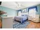 Spacious bedroom with a queen-size bed and ample closet space at 5909 Yorkshire Dr, Zephyrhills, FL 33542