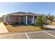 Community clubhouse with brick exterior and welcoming entrance at 5909 Yorkshire Dr, Zephyrhills, FL 33542