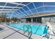 Inviting community pool with a screened enclosure at 5909 Yorkshire Dr, Zephyrhills, FL 33542