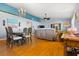 Bright dining room with hardwood floors and a chandelier at 5909 Yorkshire Dr, Zephyrhills, FL 33542