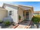 Front door entrance with white picket fence and landscaping at 5909 Yorkshire Dr, Zephyrhills, FL 33542
