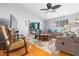 Living room with hardwood floors, comfortable seating, and a ceiling fan at 5909 Yorkshire Dr, Zephyrhills, FL 33542