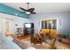 Spacious living room with hardwood floors, ceiling fan, and comfortable seating at 5909 Yorkshire Dr, Zephyrhills, FL 33542