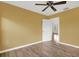 Light-filled bedroom featuring hardwood floors and a door to another room at 5971 52Nd N Ave, Kenneth City, FL 33709