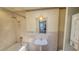 Clean bathroom with pedestal sink, shower, and tub at 616 2Nd Nw Ave, Largo, FL 33770