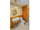 Updated bathroom with walk-in shower, wood storage, and pedestal sink at 616 2Nd Nw Ave, Largo, FL 33770
