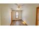 Bright bedroom with wood flooring, ceiling fan, and window at 616 2Nd Nw Ave, Largo, FL 33770