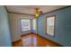 Bedroom with light blue walls and hardwood floors at 616 2Nd Nw Ave, Largo, FL 33770