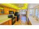 Kitchen with wood cabinets and black appliances at 616 2Nd Nw Ave, Largo, FL 33770
