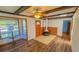 Living room with fireplace, wood flooring, and bay window at 616 2Nd Nw Ave, Largo, FL 33770