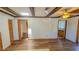 Living room with wood flooring and exposed beams at 616 2Nd Nw Ave, Largo, FL 33770