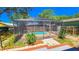 Inviting screened-in pool with surrounding deck at 616 2Nd Nw Ave, Largo, FL 33770