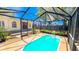 Relaxing screened-in pool with backyard view at 616 2Nd Nw Ave, Largo, FL 33770