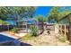 Screened-in pool with deck and fenced backyard at 616 2Nd Nw Ave, Largo, FL 33770