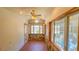 Sunroom with brick floor, stone accent wall, and garden views at 616 2Nd Nw Ave, Largo, FL 33770