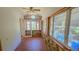 Sunroom with brick flooring, stone wall, and multiple windows at 616 2Nd Nw Ave, Largo, FL 33770