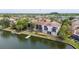 Aerial view of a waterfront building with a private dock at 6325 Newtown Cir # 25B2, Tampa, FL 33615