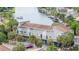 Aerial view of a waterfront building with parking and canal views at 6325 Newtown Cir # 25B2, Tampa, FL 33615